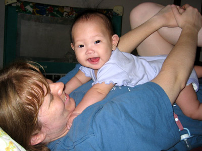 Playing on Mom's chest